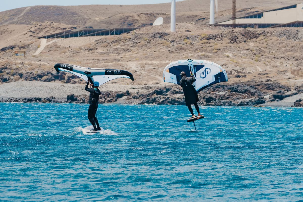 Coach and rider on the water, working through what the wing is doing